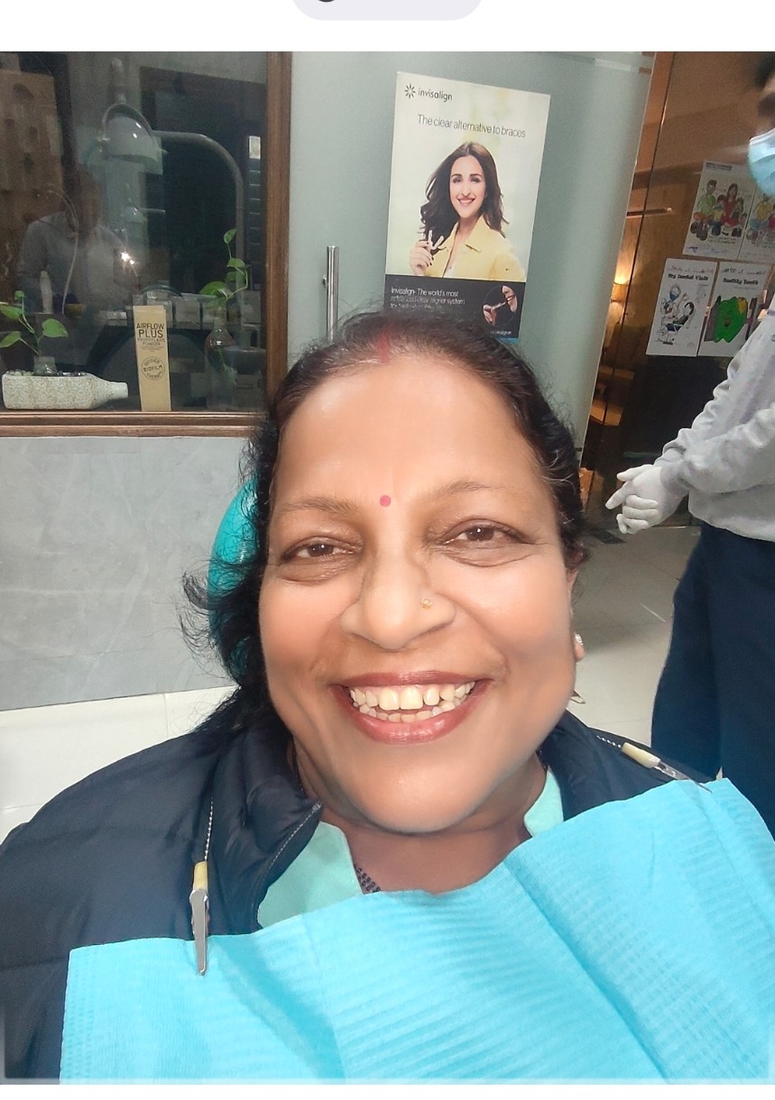 Smiling Dental Brasstacks patient in the clinic after treatment.