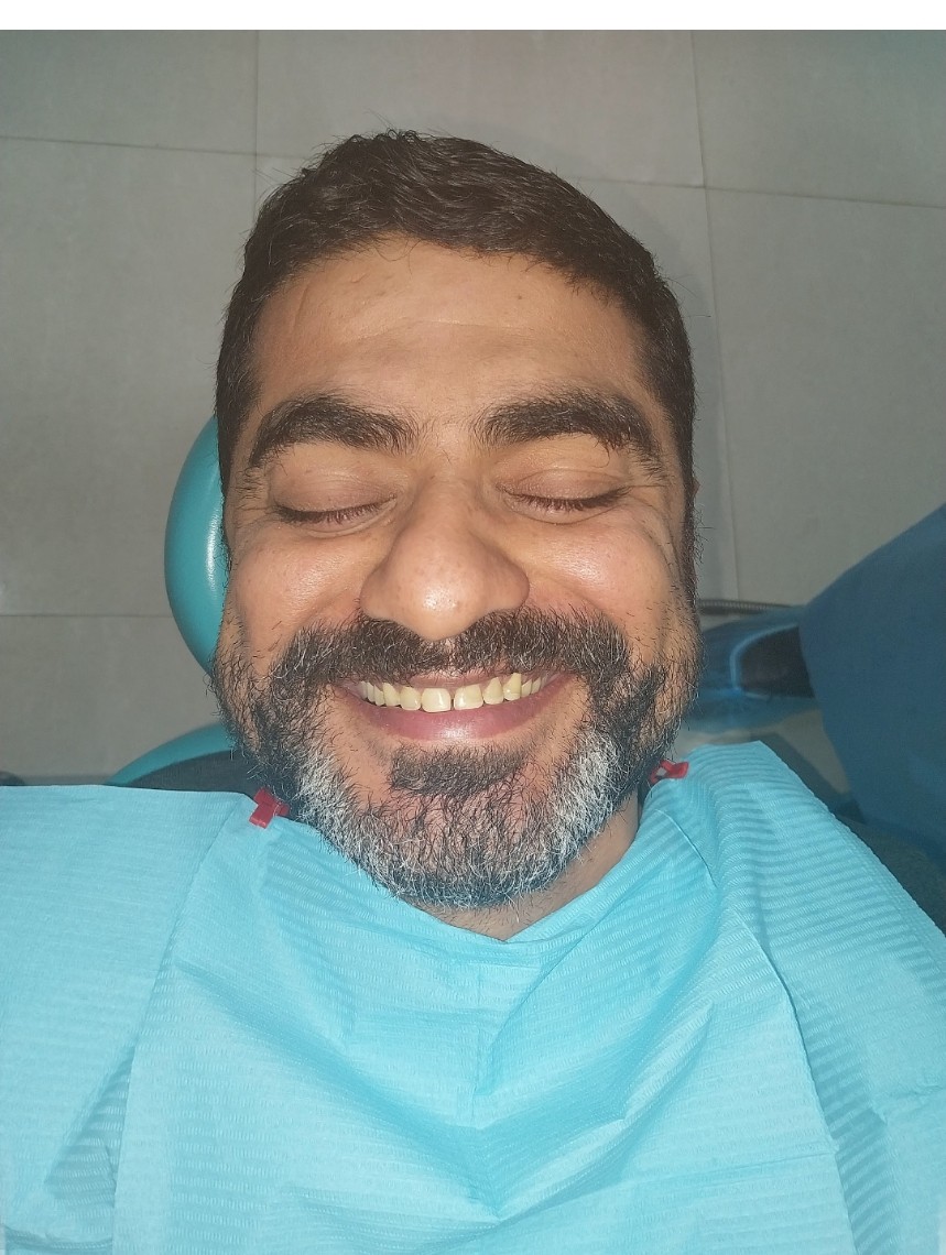 Relaxed Dental Brasstacks patient smiling during a clinic visit.